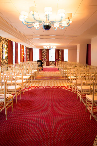 Wedding ceremony setup in ballroom